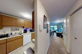 Located at 162 Chicopee Mews in Camillus, NY, this single-floor, 2-bedroom, 2-bathroom home offers a practical and comfortable layout across a well-utilized floor plan. The space includes two hallways and four closets, providing ample storage throughout.

The galley-style kitchen features warm oak cabinetry, white appliances including a dishwasher and electric range, light countertops, and tile flooring — offering an efficient, fully equipped cooking space. It opens conveniently toward the main hallway and living areas.

The living room is carpeted and highlighted by a large sliding glass door that opens to a private outdoor patio, allowing natural light and views of greenery to fill the space. A baseboard heating system runs along the wall, and there is room for a dining area alongside the main seating space.

The primary bedroom is generously sized with plush carpet, neutral walls, and a closet. The second bedroom also features carpet flooring and a window that brings in natural light. Both bathrooms are functional with tile flooring, vanity sinks, and medicine cabinets.

Two hallways connect the rooms efficiently, and the four closets distributed throughout the home offer notable storage capacity. Overall, the home presents a clean, straightforward layout well-suited for comfortable everyday living.