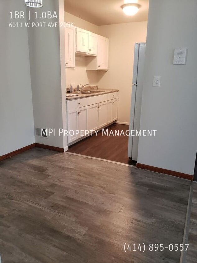 Building Photo - 6011 W Port Ave