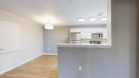 Located at 150 Autumn Way in Dickson, Tennessee, this single-story, 3-bedroom, 3-bathroom home offers a clean, modern interior with a cohesive neutral color palette throughout. Light wood-look luxury vinyl plank flooring runs continuously across all living areas, bedrooms, and bathrooms, providing both durability and visual consistency.

The open-concept living area is bright and welcoming, featuring a textured ceiling, flush-mount lighting, and a door providing access to the exterior. It flows seamlessly into the kitchen, which is defined by a peninsula breakfast bar with a white countertop, white shaker-style cabinetry, and a full suite of stainless steel appliances including a refrigerator, microwave, dishwasher, and range. Recessed skylight panels illuminate the kitchen from above.

The bedrooms are comfortable and well-proportioned, with the primary bedroom featuring a ceiling fan, a window with natural light, and an en-suite bathroom with white vanity cabinetry and a large mirror. Additional bathrooms include tub/shower combinations with clean white surrounds. Secondary bedrooms are simply appointed with closet access and neutral walls. Two hallways connect the rooms efficiently, contributing to a practical, easy-to-navigate layout throughout the home.