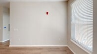 Located at 4550 Sleepy Way in Kissimmee, FL, this 2-bedroom, 2-bathroom residence offers a thoughtfully designed single-floor layout that balances comfort and functionality. The open living room greets you with light wood-look vinyl flooring, a ceiling fan with light fixture, and multiple windows fitted with blinds that invite an abundance of natural light. A glass-panel entry door further brightens the space and provides a welcoming transition from the exterior.

The kitchen is well-appointed with crisp white shaker cabinetry, granite-style countertops, a classic subway tile backsplash, and a full suite of stainless steel appliances including a refrigerator, electric range, over-the-range microwave, and dishwasher. Track lighting overhead ensures the workspace is well-lit, while wood-look flooring ties the kitchen seamlessly to the living area.

Both bedrooms feature plush carpeting and ceiling fans, with the primary bedroom offering generous proportions and a door that opens to a windowed hallway. Neutral, warm-toned walls throughout create a calm and cohesive ambiance.

The two bathrooms are finished with white cabinetry, granite-style countertops, undermount sinks, and tub-shower combinations with clean white tile surrounds, complemented by wood-look flooring for a polished, cohesive look.
