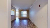 This 1100 square foot apartment in Tewksbury, MA offers a harmonious blend of space and comfort. The single-story layout encompasses three bedrooms, including a primary bedroom of 190 square feet, and two bathrooms. The living areas are thoughtfully designed, featuring two living rooms that provide versatile spaces for relaxation and entertainment.

The modern kitchen is a highlight, boasting sleek dark cabinets, stainless steel appliances, and ample counter space. Light wood-look flooring runs throughout most of the apartment, creating a sense of continuity and warmth. Large windows in the bedrooms and living areas flood the space with natural light and offer views of the surrounding greenery.

The bathrooms are well-appointed, with one featuring a striking multi-colored slate tile floor that adds a touch of elegance. Arched doorways between some rooms add architectural interest to the space. The apartment also includes a closet for storage needs.

Overall, this apartment combines functionality with aesthetic appeal, offering a comfortable and stylish living environment. Its location in the Lodge At Ames Pond complex provides a serene setting, making it an ideal home for those seeking a balance of modern amenities and natural surroundings.