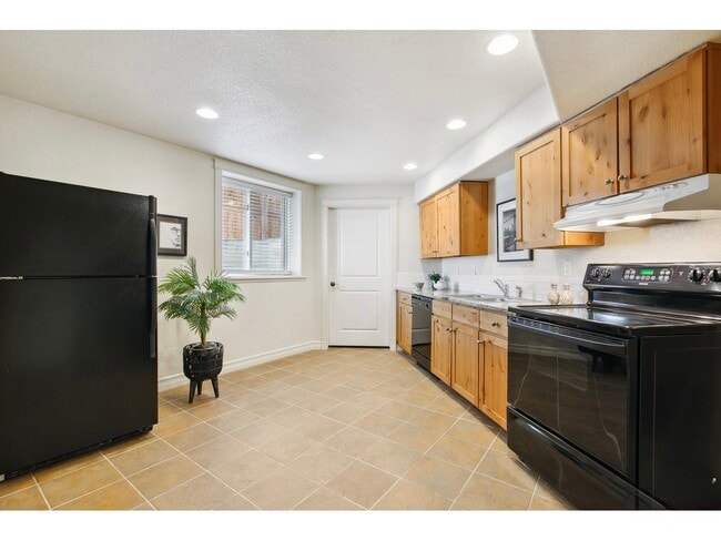kitchen and door to laundry & unfinished storage - 1005 Laporte Ave