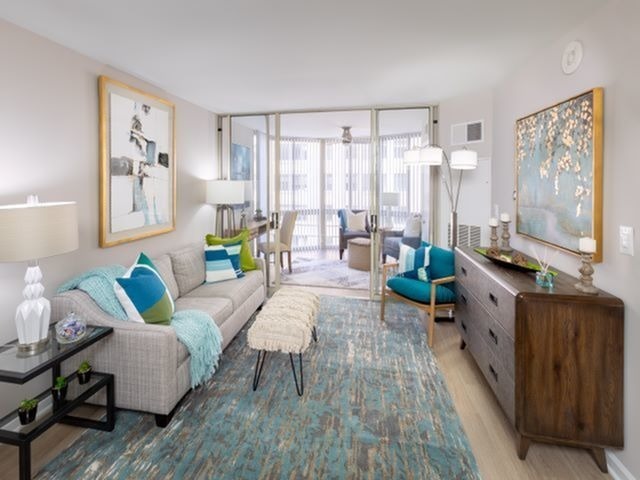 Newly Renovated Apartment With Wood-Style Flooring Throughout Kitchen and Living Areas With Sunroom - Meridian at Ballston Commons