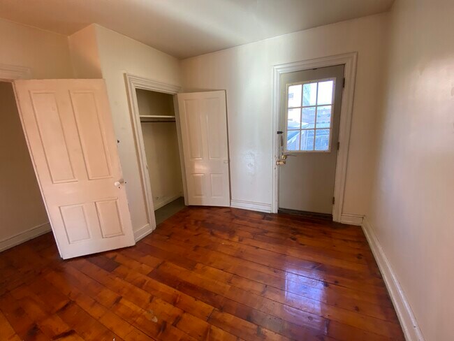 Bedroom with closet & door to fire escape - 31 E James St