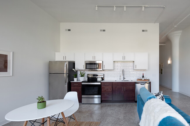 Open Living Spaces and stainless steel kitchen - Bluebird Flats