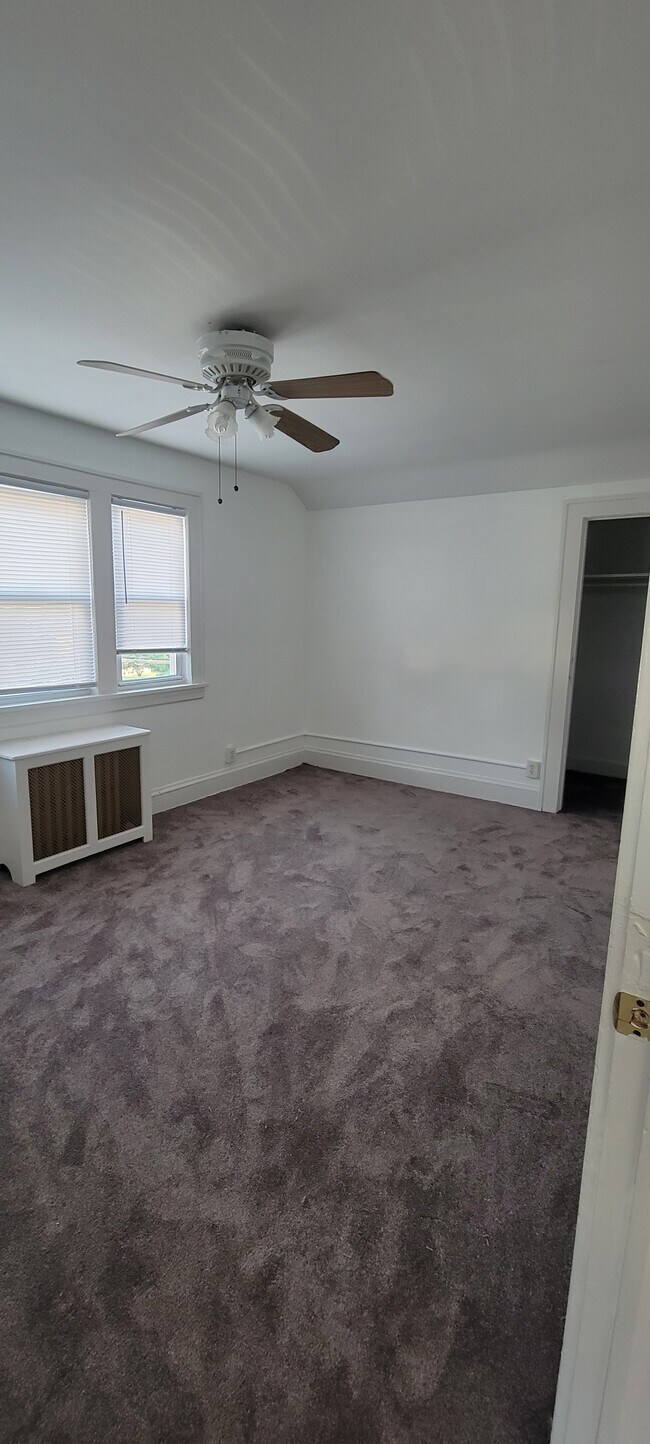 Bedroom 1, large room with ceiling fan - 684 Chestnut Ave