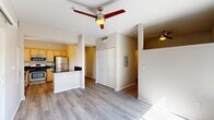 Located at 1975 Maxwell Ave in Woodland, CA, this one-bedroom, one-bathroom residence offers a thoughtfully designed single-floor layout that makes excellent use of its space. The open-concept living and dining area features light wood-look flooring and a ceiling fan, creating a bright and comfortable gathering space. A half-wall peninsula seamlessly connects the living area to the kitchen, which is well-equipped with light maple cabinetry, dark granite countertops, a stainless steel refrigerator, gas range with over-the-range microwave, and a dishwasher. A window above the kitchen sink allows natural light to fill the space. The bedroom is carpeted for warmth and comfort, ceiling fan-equipped, and features a dedicated closet with bi-fold doors. The bathroom includes a combination tub and shower, a single vanity with dark granite countertop, and hardwood-style flooring. Additional highlights include a dedicated entrance, an in-unit closet for extra storage, and access to a private balcony. The neutral color palette and cohesive finishes throughout lend the space a clean, modern aesthetic suited for everyday living.