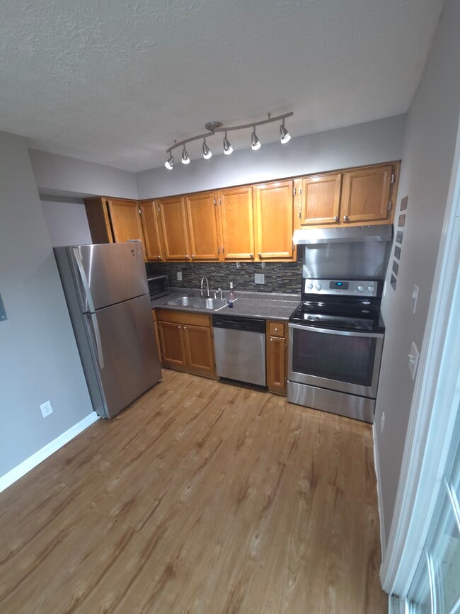 Kitchen with walkout to patio and dining area - 366 E Mithoff St