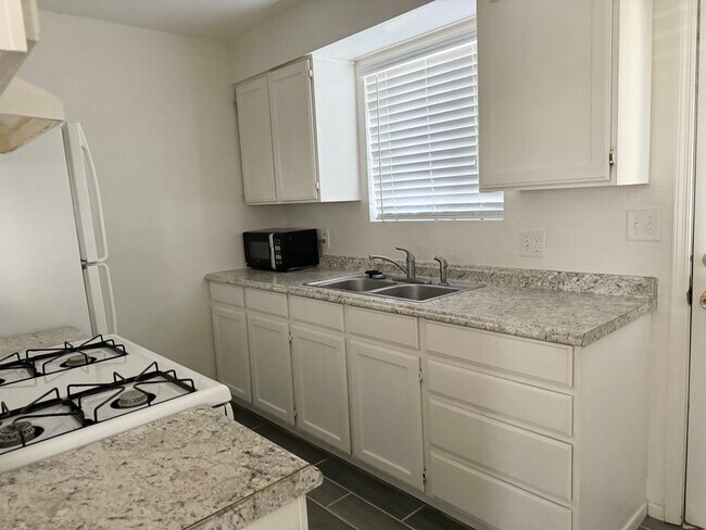 Building Photo - LONG TERM 2BD/1.5 BATH 2-STORY CONDO AVAIL...