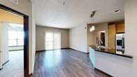 Located at 4400 W Spruce St in Tampa, FL, this well-appointed single-floor residence offers four bedrooms, three bathrooms, and a thoughtfully designed layout. The open-concept living and kitchen area serves as the heart of the home, featuring rich hardwood-style flooring, neutral-toned walls, and sliding glass doors that invite natural light and provide outdoor views. The kitchen is outfitted with warm wood cabinetry, dark granite-style countertops, a central island with an undermount sink, stainless steel refrigerator, and stylish pendant lighting overhead.

The bedrooms are carpeted for comfort, each featuring ceiling fans, window blinds, and generous closet space — including walk-in closets with wire shelving systems. The primary bedroom offers a quiet retreat with ample room and its own closet. The bathrooms are finished with light tile flooring, warm wood vanities with dark countertops, and tiled tub-shower combinations, maintaining a consistent and cohesive design palette throughout. Additional hallways and closets provide practical storage solutions. The neutral, modern finishes and functional floor plan make this residence a comfortable and versatile living space in the heart of Tampa.