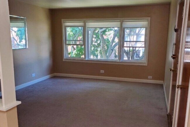 Freshly painted Living room with large window - 2643 W Rascher Ave