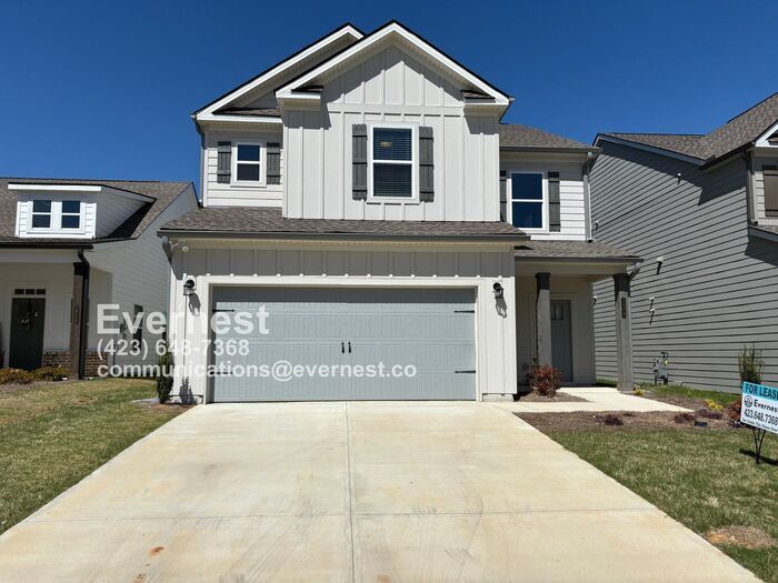 Primary Photo - 4-Bedroom Home with Modern Amenities and P...