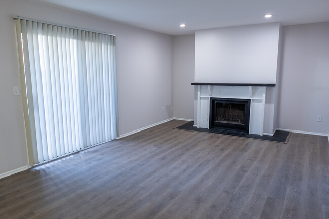 1BR/1.5 BA LIVING ROOM - College Hill Flats