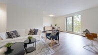 Located at 520 Mornington Ave in London, Ontario, this well-appointed 2-bedroom, 1-bathroom unit offers a thoughtfully designed single-floor layout. Light wood-tone flooring flows throughout, complementing the clean white walls and creating a bright, cohesive aesthetic across every room.

The open-concept living and dining area is a standout feature, offering generous space for both relaxing and entertaining. Large windows and balcony access bathe the area in natural light while providing pleasant outdoor views of surrounding greenery. The living room connects seamlessly to the dining space, which comfortably accommodates a dining set and features a ceiling light fixture and baseboard heating.

The kitchen is finished with white shaker-style cabinetry, dark stone countertops, a classic white subway tile backsplash, and a stainless steel double sink. Stainless steel appliances, including a refrigerator, complete the functional setup.

The primary bedroom offers a comfortable footprint with a closet and direct hallway access to the full bathroom. The second bedroom is also well-sized and bright. The bathroom features a full soaker tub and shower with clean white subway tile surround. Two hallways contribute to an efficient and organized flow throughout the unit.