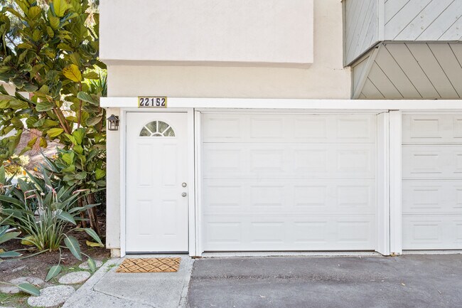 Front of home, private entry to front door and garage. - 22152 Caminito Amor