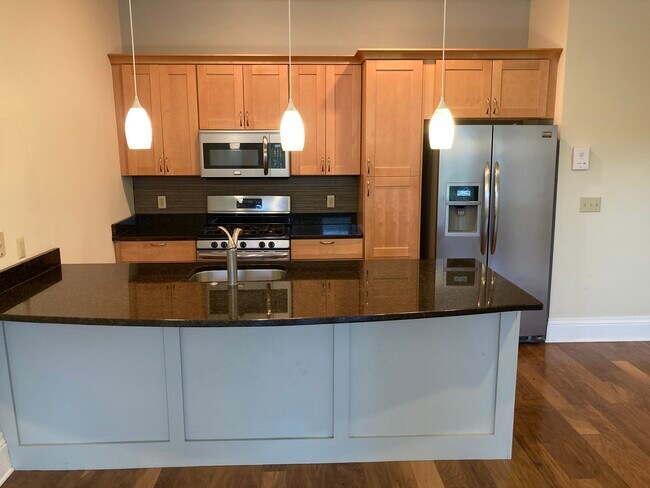 Kitchen features generous storage space - 54 E Market St