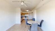 Located at 5255 NW 29th Ave in Miami, FL, this one-bedroom, one-bathroom unit offers a functional and efficiently designed single-floor layout. Light-toned ceramic tile flooring runs throughout the entire space, creating a clean, cohesive look that is well-suited to Miami's warm climate.

The combined living and dining area forms the heart of the unit, bathed in natural light from a sliding glass door that opens onto a private balcony with outdoor views. A ceiling fan overhead enhances airflow and comfort. The open layout allows for flexible furniture arrangements and provides a welcoming sense of space.

The kitchen is positioned adjacent to the living area and features light wood cabinetry, dark granite-style countertops, stainless steel appliances including a dishwasher and electric range, and a double sink — offering both style and practicality for everyday cooking.

The bedroom is a well-proportioned retreat with its own ceiling fan, a large window providing natural light and outdoor views, and a built-in closet with sliding panel doors. Additional closets are found throughout the unit, offering generous storage options.

The bathroom includes a full soaking tub with tiled surround, a toilet, and a vanity with dark countertop and wood cabinetry. A dedicated laundry area completes the unit's practical amenities, rounding out this well-appointed Miami residence.