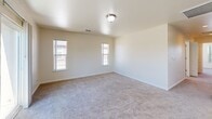 Located at 405 Eastwood Ave in Manteca, California, this well-designed 2-bedroom, 2-bathroom residence offers a comfortable and functional single-floor layout. The living room serves as the heart of the home, featuring plush carpeting, natural light from surrounding windows, and sliding glass doors that open to a private balcony — ideal for enjoying outdoor views.

The kitchen is a standout feature, boasting rich dark-espresso cabinetry, light-toned countertops, and a full suite of stainless steel appliances including a gas range, refrigerator, and dishwasher. A convenient pass-through window connects the kitchen to the living area, enhancing the open feel of the space. Light tile flooring completes the kitchen's clean, modern aesthetic.

Both bedrooms are generously proportioned, finished with soft carpeting and windows that invite natural light. The primary bedroom offers ample space and includes closet access. The second bedroom also features a window with neighborhood views.

Each bathroom is finished with neutral tile flooring, a tub-shower combination with tiled surrounds, and vanity with dark cabinetry. The primary bathroom features a dual-sink vanity, adding a practical touch. Throughout, the residence maintains a clean, neutral palette that creates a bright and welcoming atmosphere.