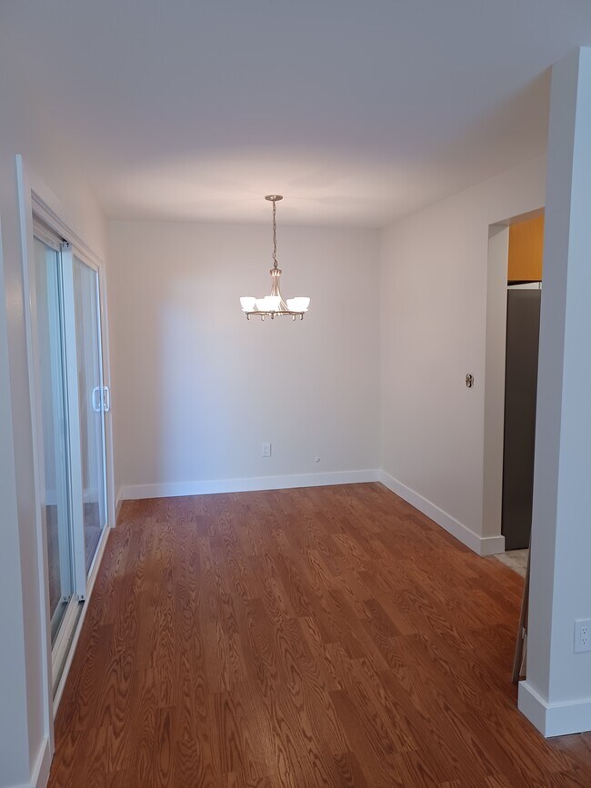 Dining area adjacent to kitchen; dining area with sliding door to outside patio - 1911 Grant Ave