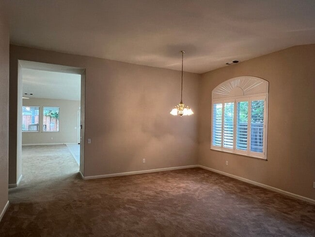 Building Photo - 4 bedrooms with 3 car garage in Rose Lane ...