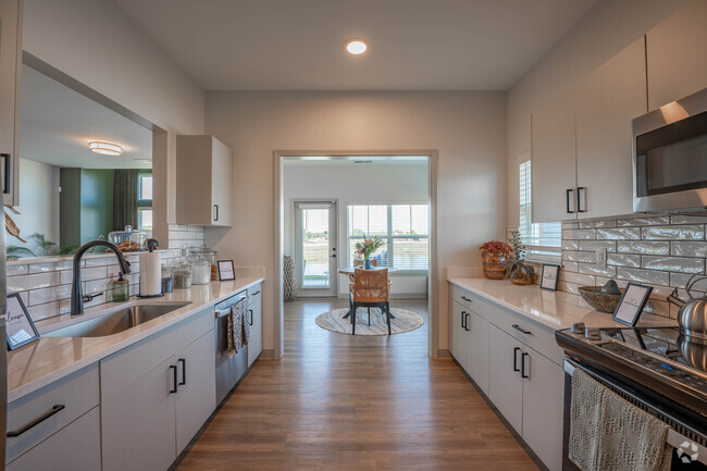 2BR, 2BA - 1,467SF - Kitchen - Promenade Trails - A 55 and Better Community