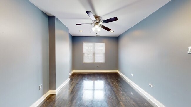 Livingroom boasts a dazzling ceiling fan and recess lights. - 10450 S Maryland Ave