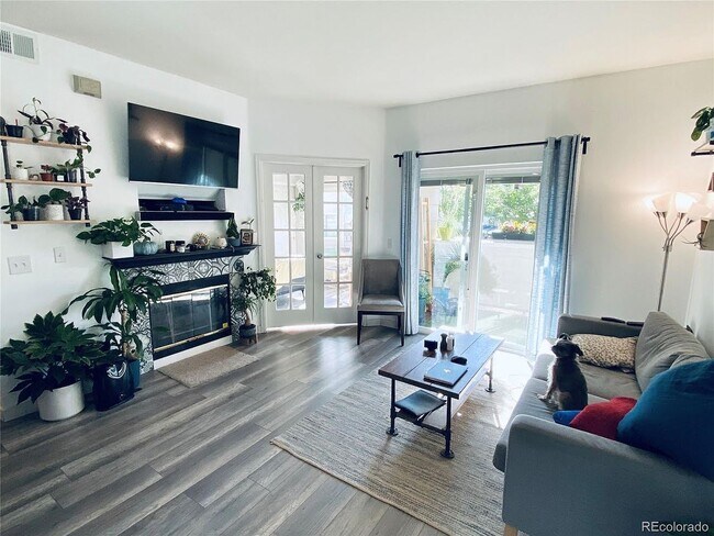 Living Room with patio access - 8707 E Florida Ave