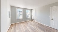 Located at 1603 Roane St in Richmond, Virginia, this single-floor home showcases a clean, modern aesthetic throughout, with fresh light gray paint, crisp white trim, and durable light-toned hardwood-style flooring that flows seamlessly from room to room. The layout is open and functional, offering a well-connected living experience across all areas of the home.

The kitchen serves as a clear highlight of the space, featuring white shaker-style cabinetry, granite countertops with subtle veining, a stainless steel undermount sink, and a full suite of stainless steel appliances including a refrigerator, range, over-the-range microwave, and dishwasher. A window brings in natural light, and a louvered-door closet provides convenient pantry storage.

Adjacent to the kitchen is a dining area with its own window, offering a bright and casual space for everyday meals. The living areas are generously sized, with large windows that allow natural light to fill the rooms and offer views of the surrounding neighborhood.

The bedrooms are well-proportioned, each featuring the same hardwood-style flooring, soft gray walls, and large windows fitted with blinds. HVAC vents are present throughout, ensuring year-round comfort. The bathroom includes a full tub-shower combination with chrome fixtures and a clean, white surround. A utility area with an accessible electrical panel is also incorporated into the layout.