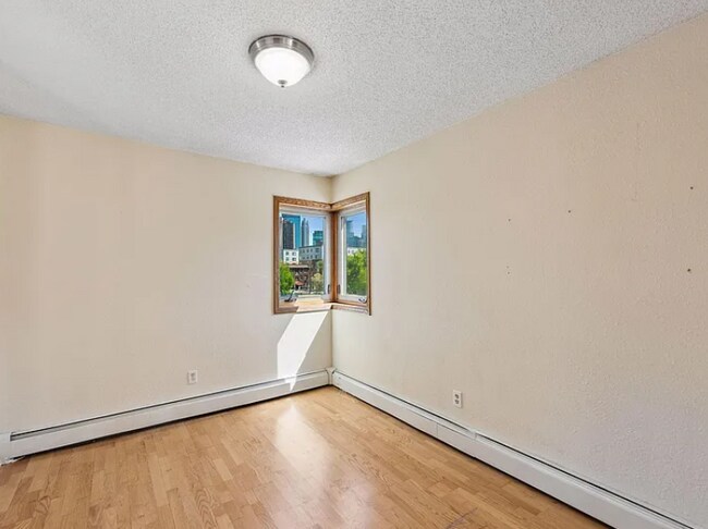 Building Photo - Awesome 2-Bed Condo Retreat in the Heart of Minneapolis  with Skyline views of Downtown