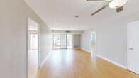 Located at 3415 West End Ave in Nashville, Tennessee, this 2-bedroom, 4-bathroom residence offers a well-designed single-floor layout with a clean, neutral aesthetic throughout. Light-toned hardwood-style flooring runs continuously across the living spaces, complementing the soft gray walls and crisp white trim to create a bright, cohesive interior.

The spacious living room serves as the heart of the home, featuring a ceiling fan, abundant natural light, and sliding glass doors that open to a private balcony with outdoor views. The open sightlines give the space a generous, airy feel. The kitchen is equipped with stainless steel appliances, including a full-size refrigerator, and connects conveniently to the rest of the living areas.

Both bedrooms are comfortably sized, with the primary bedroom offering notable square footage, a ceiling fan, and access to a dedicated closet. The second bedroom also features a ceiling fan and a closet, providing practical storage solutions. Four bathrooms serve the residence, with at least one featuring a tiled tub/shower combination with classic white wall tile and decorative mosaic floor tile in neutral tones.

Throughout the unit, consistent finishes and a well-maintained interior reflect a move-in-ready condition, making this residence a functional and attractive option in the West End neighborhood of Nashville.