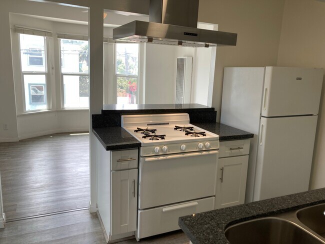 The white stove & refrig. have now been replaced with stainless steel appliances - 102 Breeze Ave