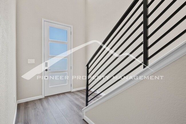 Building Photo - Contemporary Townhome in the Vibrant Interquest Low Maintenance Community with 2 car garage, Wash...