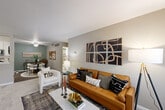 Located at 15685 Goddard Rd in Southgate, Michigan, this single-floor, two-bedroom, two-bathroom home offers a well-designed layout with a comfortable and functional living experience. The open-concept living room flows seamlessly into the dining area, featuring neutral-toned walls, plush carpeting, and large windows that invite natural light. A distinctive green accent wall in the dining area adds a touch of character to the shared space.

The kitchen is outfitted with white shaker cabinetry, marble-style countertops, stainless steel appliances, and hardwood-style flooring, balancing style with practicality. A dedicated utility room with in-unit laundry adds everyday convenience.

The spacious primary bedroom features dual windows with outdoor views, soft carpeting, and neutral walls, creating a calm and restful retreat. The second bedroom is equally well-appointed with natural light. Both bathrooms are finished with white tile flooring, white cabinetry, marble-style countertops, and tub/shower combinations, offering a clean, classic aesthetic.

Three closets throughout the home provide generous storage. The entrance leads directly into the main living area, and a hallway connects the bedrooms and bathrooms, creating a logical and efficient floor plan throughout.