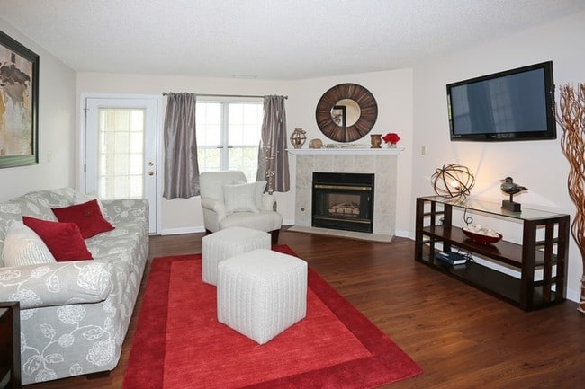 Living Space with Fireplace - Windsong Place Apartments
