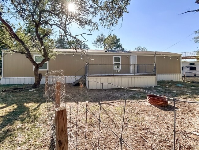 Building Photo - Move-In Ready Home Near Canyon Lake – Fresh Interior, Deck & Detached Garage