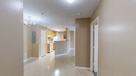 Located at 616 Highway 90 in Waveland, Mississippi, this single-floor unit offers a well-organized layout with three bedrooms, two bathrooms, and a dedicated laundry room. The galley-style kitchen features warm honey-toned cabinetry, granite-look countertops, a double basin sink, and white appliances including an electric range and dishwasher — efficiently designed to maximize functionality. The living area is bright and open, highlighted by a ceiling fan with light fixture and French doors that bring in natural light and provide access to a covered porch overlooking the community grounds. Neutral tan walls and light-toned flooring carry consistently throughout the main living areas, lending a cohesive, clean aesthetic. The primary bedroom is a comfortable size and includes direct access to a private en-suite bathroom, which features a wood-toned vanity with granite-look counters. The secondary bedrooms are carpeted and receive natural light through slatted windows. A second full bathroom with a tub/shower combo serves the remaining rooms. The dedicated laundry room accommodates a full-size washer and includes overhead shelving for additional storage. Two closets provide further organization throughout the unit. A private porch entry completes this practical and well-appointed home.