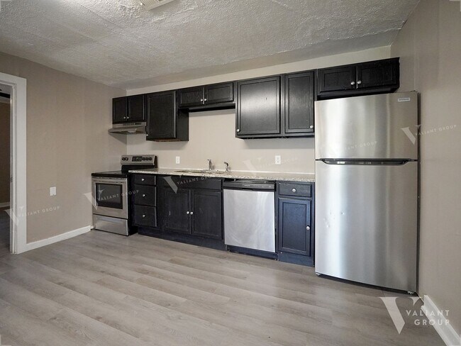 Building Photo - Charming Three-Bedroom, Two-Bathroom Stone...