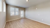 Located at 5720 Ogeechee Rd in Savannah, GA, this single-story 1-bedroom, 1-bathroom home offers a well-designed, functional layout across a generously sized floor plan. Light-toned luxury vinyl plank flooring flows consistently throughout, lending the space a clean, cohesive aesthetic.

The heart of the home is an open-concept kitchen and living area. The kitchen is appointed with two-tone cabinetry — white upper cabinets paired with darker lower cabinets — granite countertops, a subway tile backsplash, and a full suite of stainless steel appliances including a refrigerator, range, microwave, and dishwasher. A central island with a granite surface and stylish pendant lighting above serves as both a prep space and a focal point. A pantry adds valuable storage.

The spacious bedroom features a ceiling fan, large windows with blinds that invite natural light, and direct access to the laundry area. The bathroom includes a combination tub/shower as well as a separate walk-in shower with a sliding glass barn-style door and built-in shelving. Multiple closets provide ample storage throughout. A dedicated utility room and an entry hallway with a smart thermostat panel round out this thoughtfully equipped home.