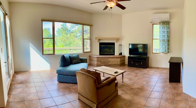 Spacious, bright living room with gas fireplace, A/C cooled - 4750 Quemazon
