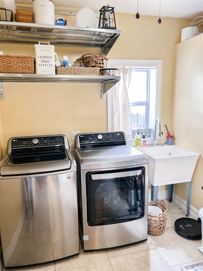 Laundry room with large industrial shelves for storage - 106 E Madison Ave