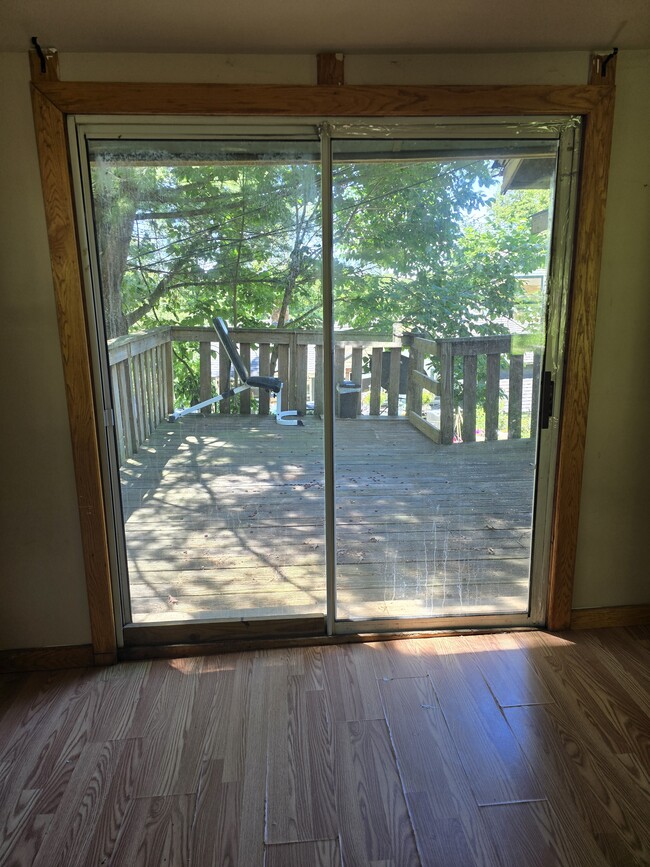 Doors to enter the deck on the side of the house - 33 Maple Trl