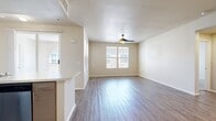 This contemporary apartment in Rancho Cucamonga offers 950 square feet of well-designed living space. The unit features three bedrooms, including a spacious 160 sq ft primary bedroom, and three full bathrooms. The open-concept layout seamlessly integrates the kitchen and living areas, creating an inviting atmosphere for both relaxation and entertaining.

The kitchen boasts modern appliances, including a sleek gas range and built-in microwave, complemented by light-toned cabinetry and quartz countertops. Large windows throughout the apartment flood the space with natural light, while ceiling fans ensure comfort. The bathrooms are outfitted with modern fixtures and finishes, including tiled shower/tub combinations.

Flooring varies throughout, with durable laminate in main living areas and plush carpeting in bedrooms. The in-unit laundry room, equipped with a high-efficiency washer and dryer, adds convenience. Two additional closets provide ample storage space.

Located at 8200 Haven Avenue, this apartment offers a perfect blend of style and functionality in a desirable Rancho Cucamonga neighborhood.