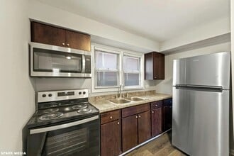 Building Photo - 7617 S Colfax Ave