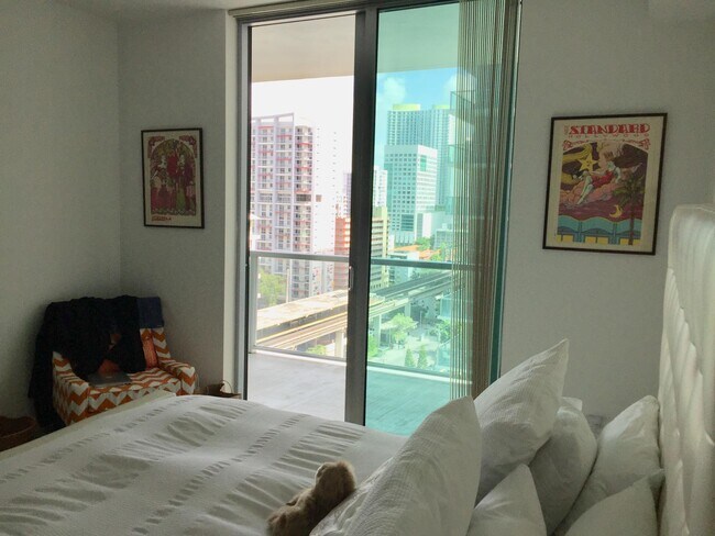 Master bedroom with great access to the balcony gives a resort feeling to your everyday ! - 79 SW 12th St