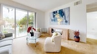 This 880 square foot condominium in Pembroke Pines, Florida, offers a well-designed living space with two bedrooms and three bathrooms. The single-story layout maximizes functionality, featuring an open-concept living and dining area that flows into the kitchen. The living room is adorned with plush carpeting and showcases a sliding glass door leading to a balcony, allowing natural light to flood the space and providing views of the surrounding area.

The kitchen, while compact, is efficiently designed with light wood cabinetry, white appliances, and a practical layout. It includes ample storage and counter space, making it suitable for everyday meal preparation. The primary bedroom, measuring 160 square feet, offers a serene retreat with neutral tones and a spacious closet. The bathrooms feature clean lines and modern fixtures, with at least one offering a full-sized bathtub.

A notable amenity is the in-unit laundry room, adding convenience to daily living. Throughout the condo, the color palette is predominantly neutral, creating a bright and airy atmosphere that can easily be personalized. The property's location at 13751 NW 4th St in Pembroke Pines places residents in a desirable area, likely with access to local amenities and transportation routes. This condo presents an ideal option for those seeking a low-maintenance lifestyle in a prime Florida location.
