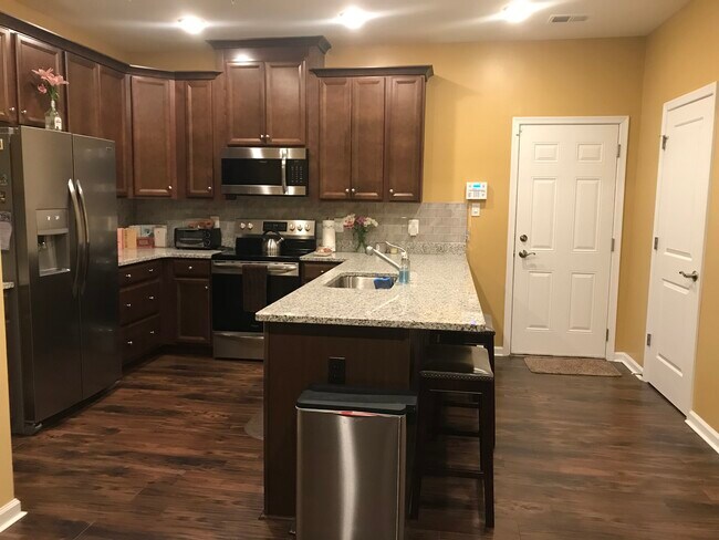 Access to shared kitchen with granite counter tops, hard wood floors, pantry and security system - 2719 Pinebrook Rd