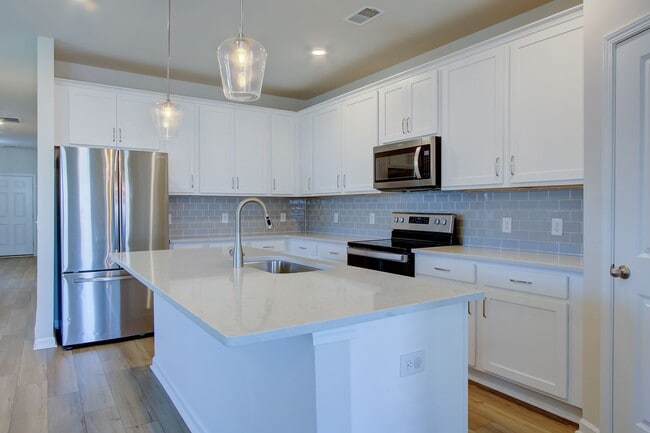 Building Photo - Spacious 4BR Rental with Stunning Kitchen & Covered Patio