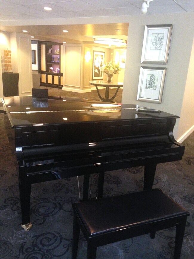 Grand piano in common area - 4601 N Park Ave