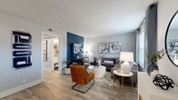 Located at 231 New Shackle Island Rd in Hendersonville, Tennessee, this single-story, 2-bedroom, 1-bathroom residence offers a thoughtfully designed layout with modern finishes and a cohesive style throughout. Wood-look flooring flows through the main living areas, complemented by a neutral gray and bold navy accent wall color scheme that lends the space a contemporary, polished feel.

The open living and dining area serves as the heart of the home. The living room features a striking navy accent wall, natural light from large windows dressed in stylish curtains, and a textured ceiling. The adjacent dining area mirrors this design with its own navy accent wall, a bright window, and an intimate setting ideal for gathering.

The kitchen is well-equipped with white shaker cabinetry, granite countertops, stainless steel appliances, and wood-look flooring, offering both function and style in a clean, galley-style layout.

Both bedrooms are carpeted for comfort and include ceiling fans, large windows with natural light, and navy accent walls. The primary bedroom is generously sized and provides a restful retreat.

The full bathroom features wood-look tile flooring, a tiled tub-and-shower surround, white vanity cabinetry with granite countertops, and classic fixtures. Hallways and a closet round out the efficient, well-connected floor plan.