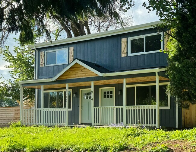 New exterior paint, freshly installed roof and exterior door - 1014 W 23rd St